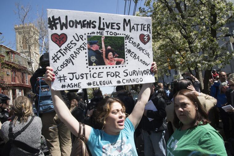 Protesters cheer and hold signs as Bill Cosby leaves the courtroom after being found guilty of sexual assault Thursday, April 26, 2018, at the Montgomery County Courthouse in Norristown, Pa.