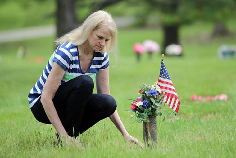 Jeanne Sides Sewell visits the grave of her husband, Thomas Sewell, at Valley Forge Memorial Gardens in King of Prussia, Pa. on May 12, 2014. ( DAVID MAIALETTI / Staff Photographer )