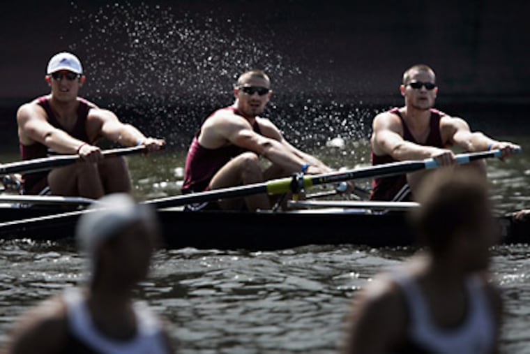 Temple rowers Brendan Cunningham, Tom Masterson and John Masterson finish first in their heat. (Laurence Kesterson / Staff Photographer)