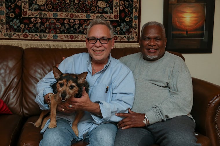 Angelo Garcia and Glenn Lewis with their dog, Pepe. The two just celebrated their 5 year wedding anniversary last month, Tuesday, October 26, 2021.