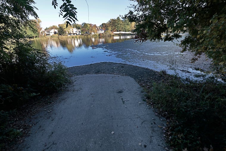 The exposed end of the boat ramp into Pitman’s Alcyon Lake in Gloucester County last month.