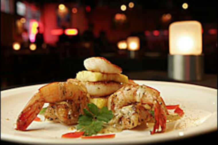 The jerk-seasoned starter of shrimp, scallops and warm chips of grilled pineapple was tasty and showed the originality that chef Don Wharton is capable of.