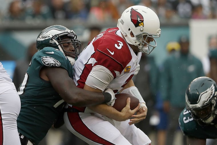 Eagles’ Vinny Curry sacks Cardinals QB Carson Palmer.