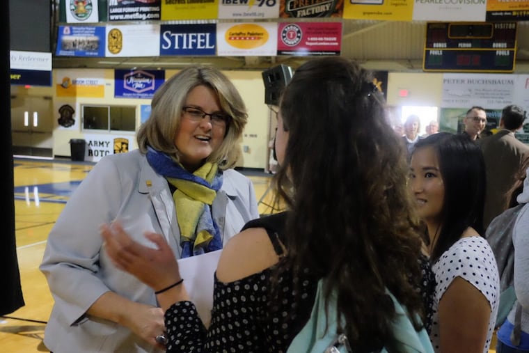 La Salle University President Colleen Hanycz happily greets juniors Marissa Beaver , , center, and Emily Paynter, right, on campus last year. Ed Hille / Staff Photographer