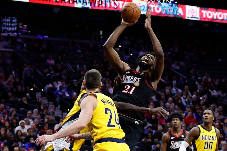 Sixers star Joel Embiid, left, scored 39 points in his team's win over the Pacers.