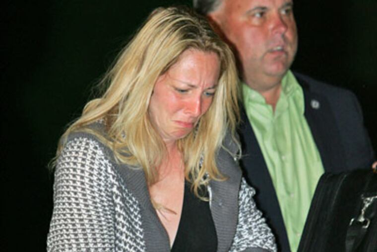 Bonnie Sweeten, in the custody of Bucks County and Upper Southampton detectives, is escorted Friday night into the court of District Justice William
Benz in Richboro. (David Swanson / Staff Photographer)