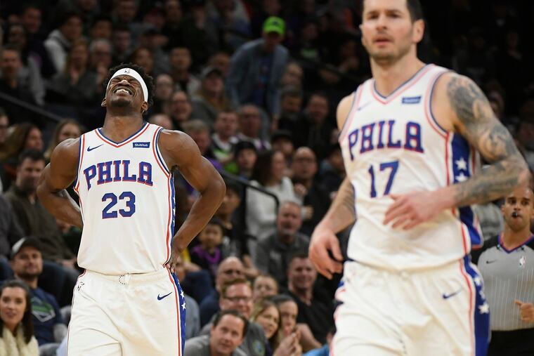 The Philadelphia 76ers' Jimmy Butler (23) winces in pain after a first-quarter injury against the Minnesota Timberwolves at Target Center in Minneapolis on Saturday, March 30, 2019. The Sixers won, 118-109. (Aaron Lavinsky/Minneapolis Star Tribune/TNS)