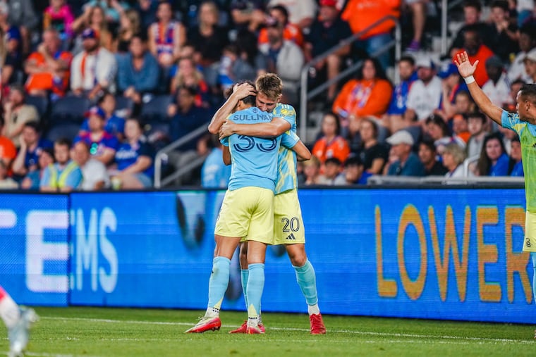 Bruno Damiani (right) celebrates with Quinn Sullivan during the Union's win against FC Cincinnati on Saturday.