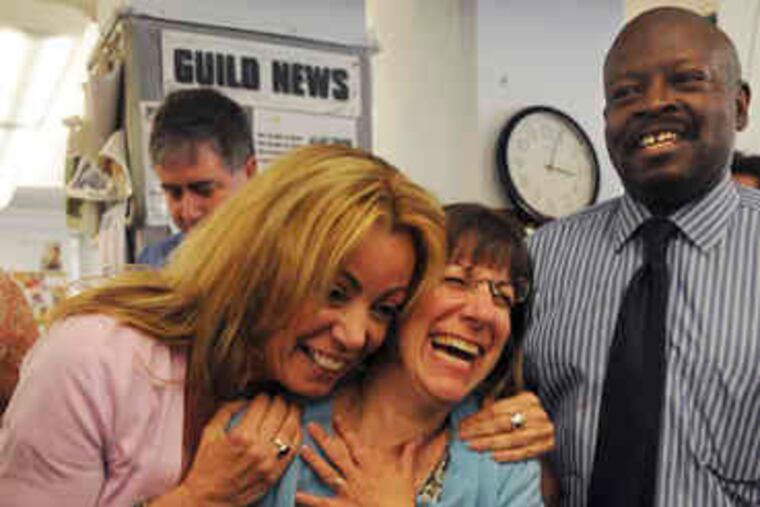 Laker (left), Ruderman and Daily News Editor Michael Days relish the moment just after the prize was announced. Editorial, Page 15.