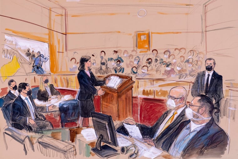 This artist sketch depicts Guy Wesley Reffitt, bottom right, joined by his lawyer William Welch, third from right, listening as prosecutor Risa Berkower, speaks at the podium at center, as a video depicts a handgun on the waist of Reffitt, at left, for members of the jury and audience in Federal Court, in Washington, Monday, March 7, 2022. Reffitt, a Texas man charged with storming the U.S. Capitol with a holstered handgun on his waist, is the first Jan. 6 defendant to go on trial. Also pictured from left, are prosecutors Tom Ryan, Jeff Nestler, and Amanda Rohde. Man at top right is unidentified.