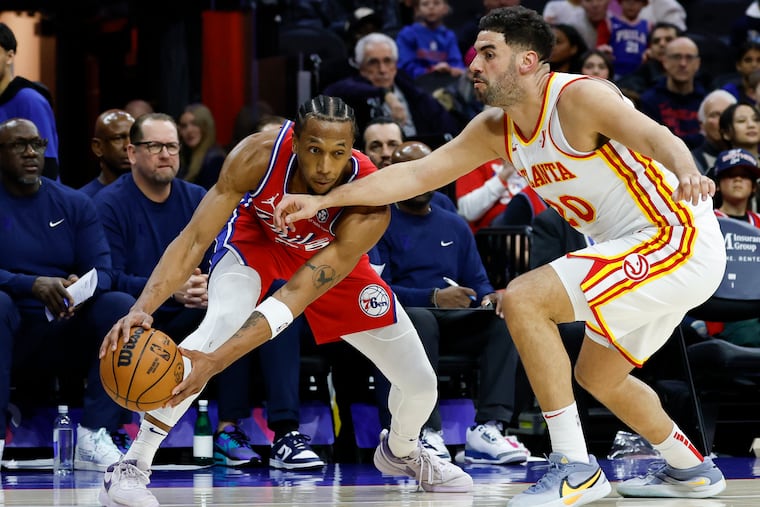 Sixers forward Marcus Bagley holds the ball as Atlanta Hawks forward Georges Niang defends in the second quarter on April 11.