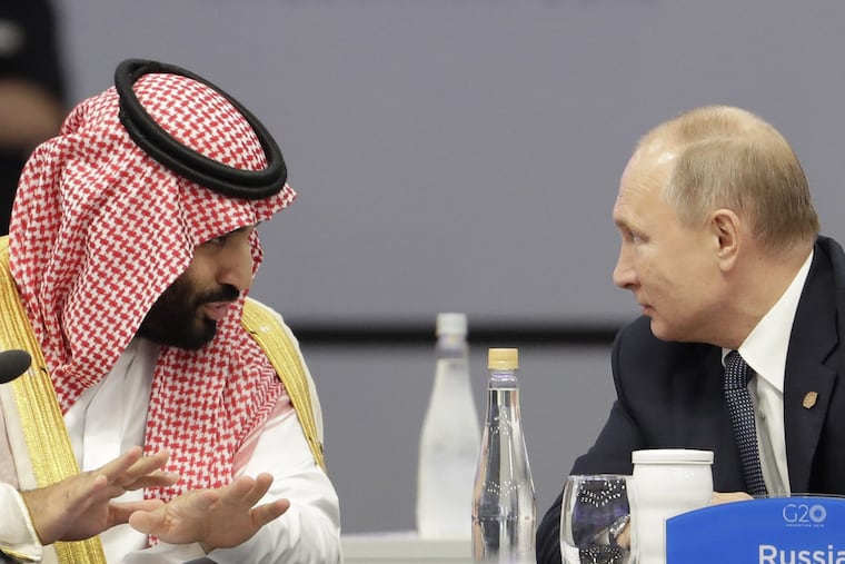 Saudi Arabia's Crown Prince Mohammed bin Salman, left, and Russia's President Vladimir Putin speak at the start of the G20 summit in Buenos Aires, Argentina, Friday, Nov. 30, 2018. The two leaders are controversial figures at the summit. In Putin's case, other world leaders have expressed concern over Russia's recent seizure of Ukrainian ships and their crews near Crimea. For the prince, it's about the killing of a dissident Saudi journalist in the country's Istanbul consulate. Saudi Arabia denies that bin Salman ordered the killing, but U.S. intelligence agencies have concluded the opposite. (AP Photo/Natacha Pisarenko)