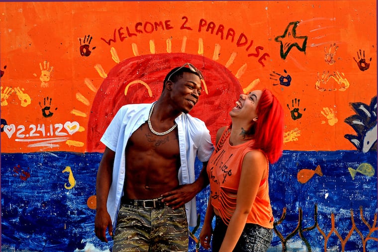 Best friends "Bear" and "Jaz" chat in front of a mural in Camden in 2014. Photo by April Saul ***One-time use only for Sunday Opinion Sept. 1, 2024***