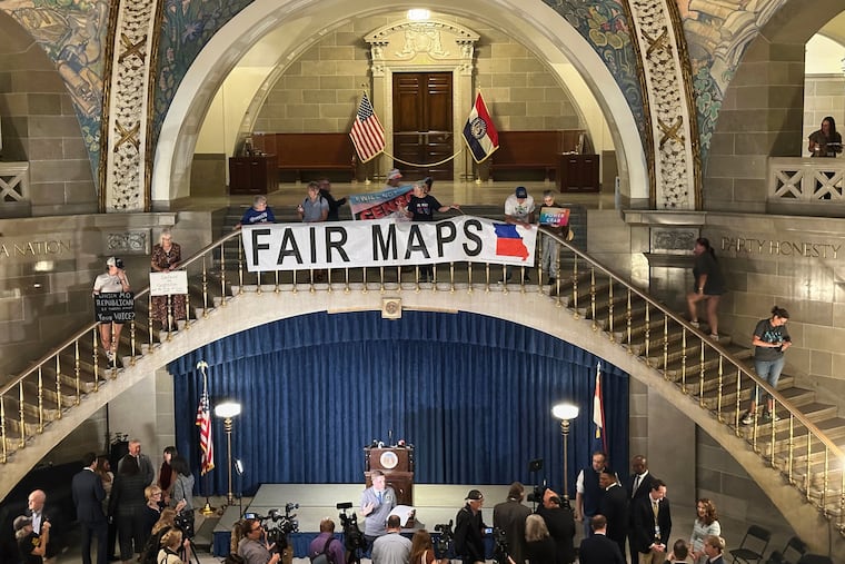 Opponents of Missouri's Republican-backed congressional redistricting plan display a banner in protest at the State Capitol in Jefferson City, Missouri, Sept. 10, 2025.