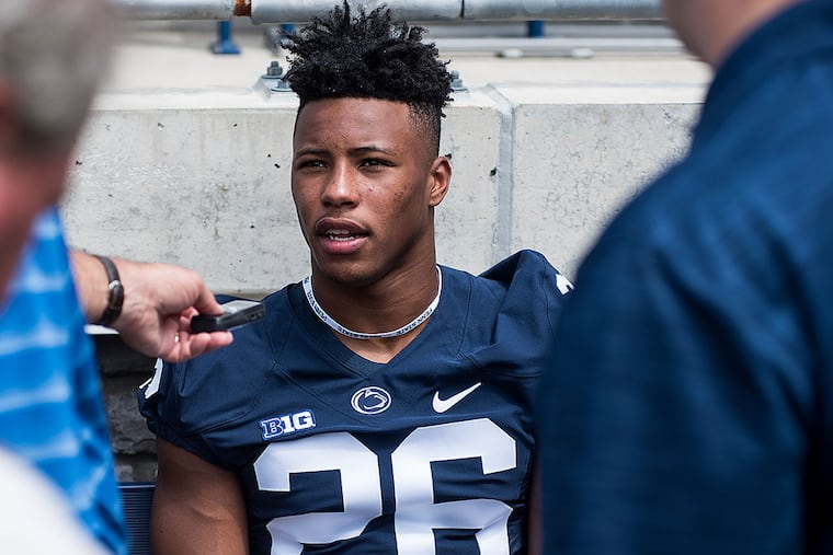 Penn State running back Saquon Barkley scored on a 55-yard run against Temple.