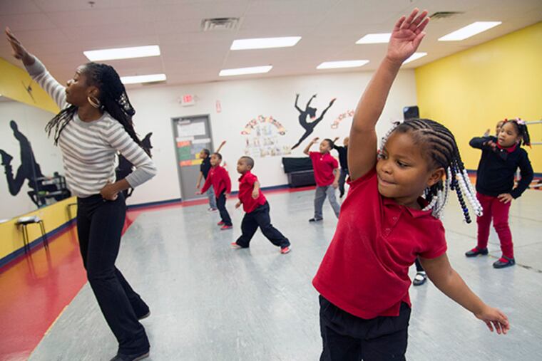 Kindergartner Johnae Myars, 5, keeps up with dance teacher Erica Brown at Chester Charter School for the Arts. ( CLEM MURRAY / Staff Photographer )