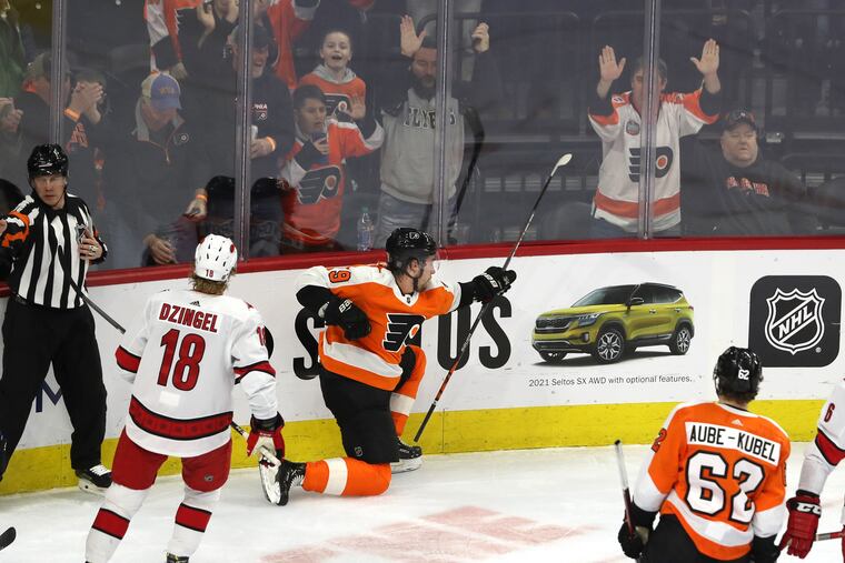 Ivan Provorov, center, celebrates his first-period goal against the Hurricanes on Thursday.