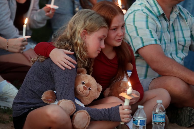 People gather at a vigil at Lynnhurst Park after a shooting at the Annunciation Catholic School in Minneapolis on Wednesday, Aug. 27, 2025.