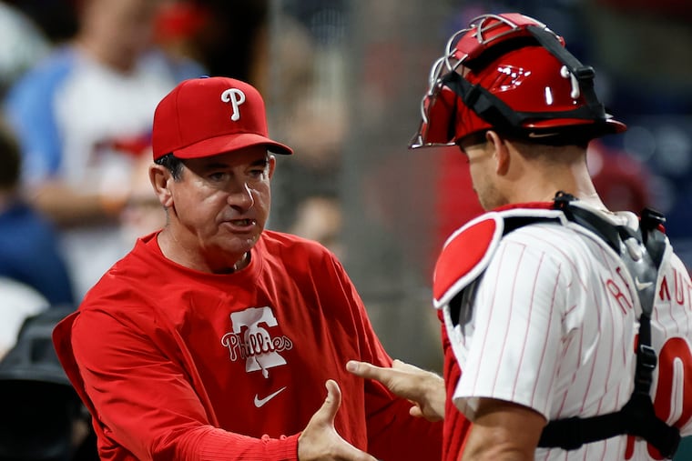 Phillies catcher J.T. Realmuto (right) says the players ultimately are responsible for Rob Thomson's firing. "We know that we’re the ones on the field not doing our job.”