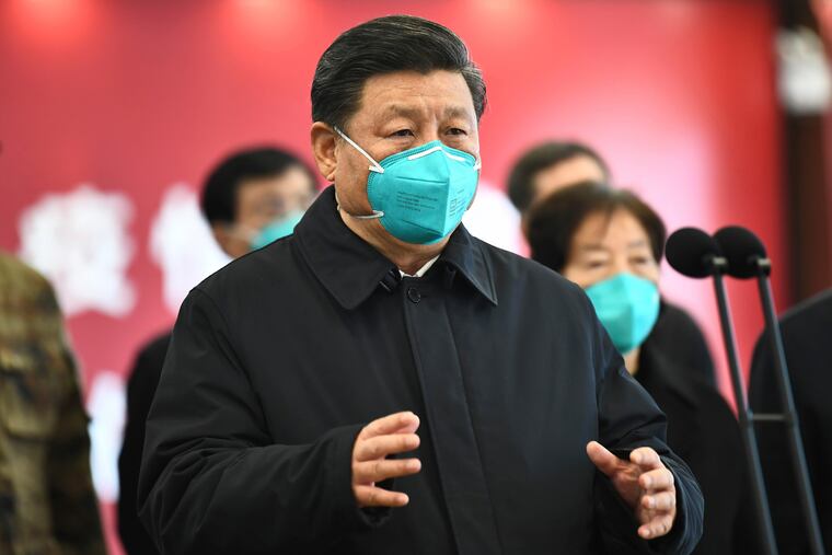 In this Tuesday, March 10, 2020, photo released by China's Xinhua News Agency, Chinese President Xi Jinping talks by video with patients and medical workers at the Huoshenshan Hospital in Wuhan in central China's Hubei Province. Top Chinese officials secretly determined they were likely facing a pandemic from a novel coronavirus in mid-January, ordering preparations even as they downplayed it in public. Internal documents obtained by the AP show that because warnings were muffled inside China, it took a confirmed case in Thailand to jolt Beijing into recognizing the possible pandemic before them.