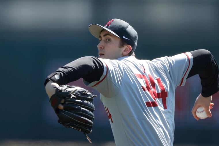 Harvard pitcher Chris Clark throws against Penn during a game on March 26.