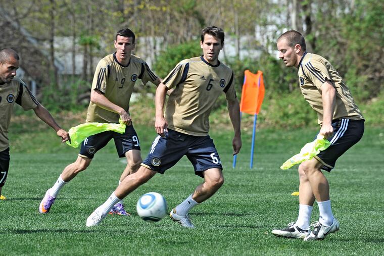Jordan Harvey (right) at a Union practice in April 2010, a few days before the first home game in team history.