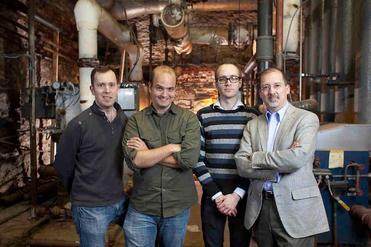 In the boiler room of Crane Old School are (from left) Pig Iron’s Quinn Bauridel, John Frisbee, Marc Miller, and Scott Reynolds.