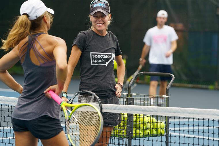 Ruth Dickinson is a runner and tennis player who had a joint replacement, she is shown here during one of the many tennis lessons she teaches, at Conestoga Swim Club, in Villanova, Pa., Friday July 27, 2018.