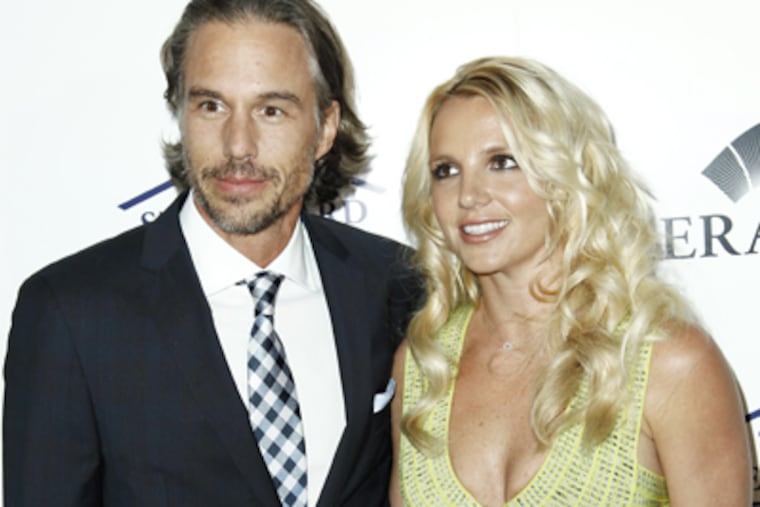 In this May 11, 2011 file photo, singer Britney Spears, right, and Jason Trawick arrive at an Evening of "Southern Style" in Beverly
Hills, Calif. Trawick announced Dec. 16 on "Access Hollywood" that he and Spears are engaged. The two have been dating since 2009. (AP Photo/Matt Sayles, file)