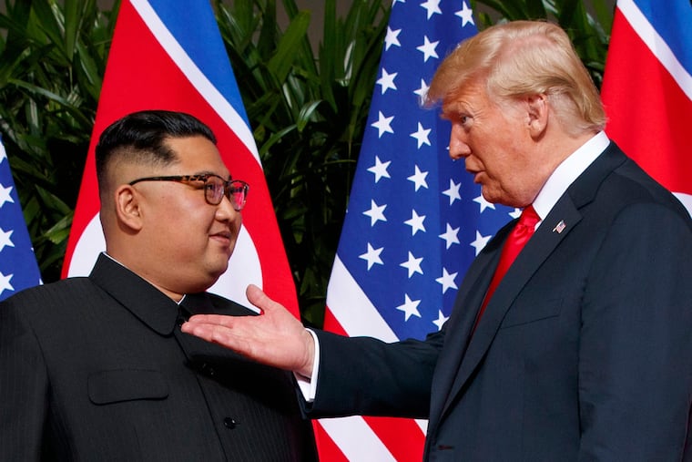 President Donald Trump meets with North Korean leader Kim Jong Un on Sentosa Island in Singapore on June 12, 2018.