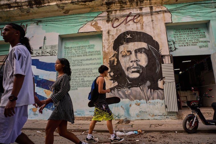 People walk past a mural of Che Guevara in Havana on Feb. 17.