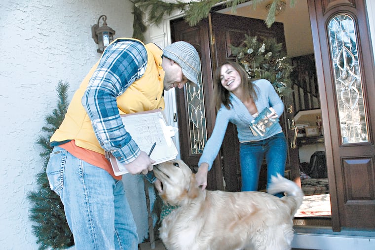 In this 2009 file photo, John Friers goes door to door in Haddon Township, N.J. asking folks about whether their dogs are properly licensed. Here, he visits the home of Nina Swallow.
