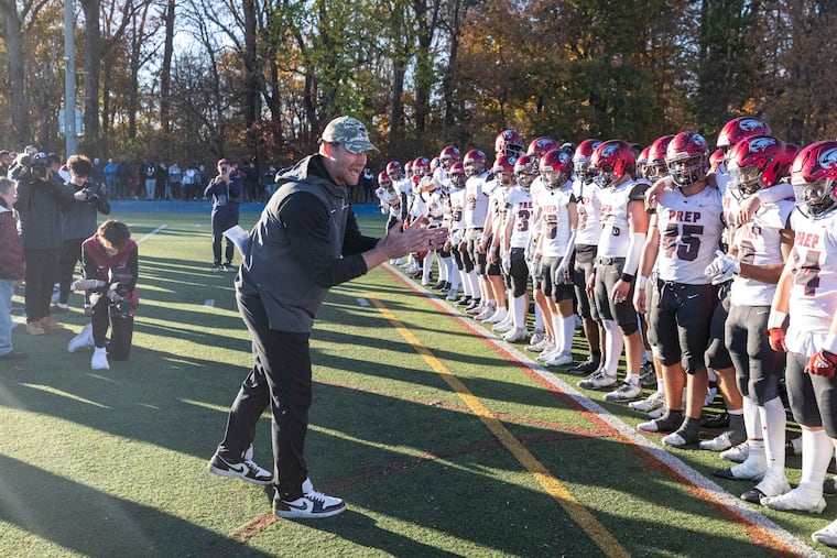 St. Joseph's Prep coach Timothy Roken congratulates his team for its win against La Salle College High at Wissahickon High School on Nov. 9.