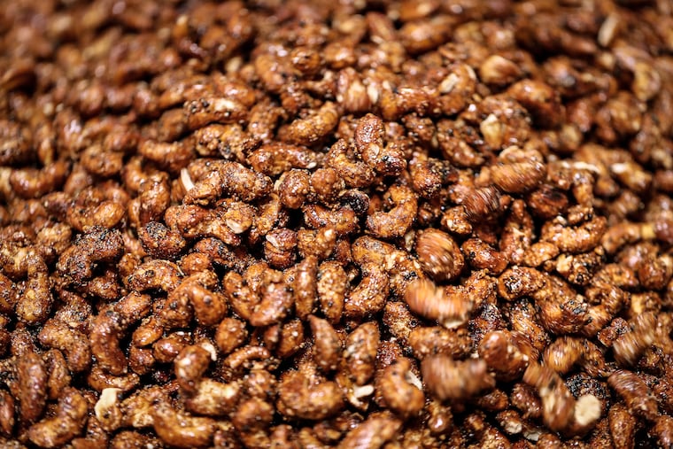 A freshly roasted batch of black lava cashews cool off at Di Bruno Bros. Snacks in Philadelphia, Pa., on Aug. 14, 2019.