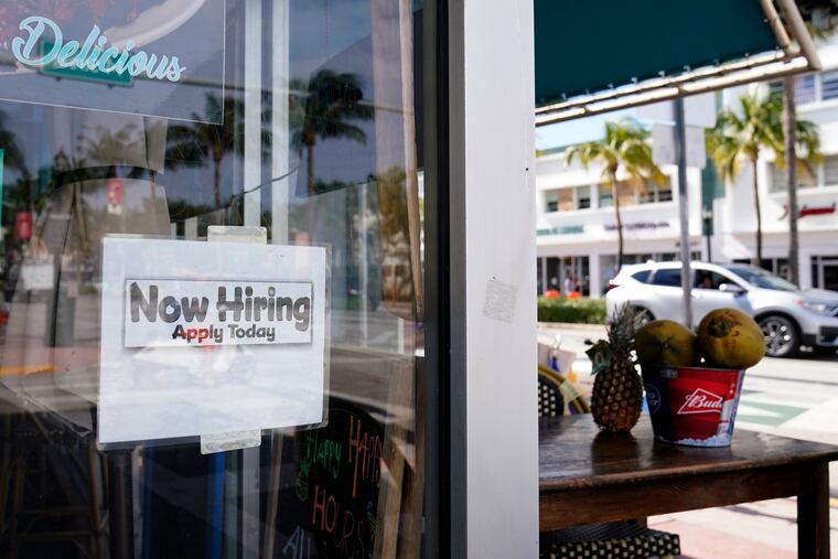 A "Now Hiring" sign in the window of a restaurant in Miami Beach, Fla., on Thursday.