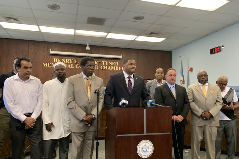 Atlantic City Council President Marty Small Sr. addresses the media and community members about an effort to change the form of government that he described as a plan to usurp the authority of local government. He is flanked by City Council members and community representatives.