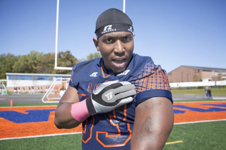Maurice Bertrand, Lincoln football player, shows one of his scars from the shooting. (Ed Hille / Staff Photographer)