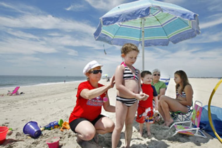 In Cape May, Christina Pettigrew (left) with (from left) Amber, T.J. and Marina Hollman, and her mother, Fran Stafford. (Elizbeth Robertson / Staff Photographer)