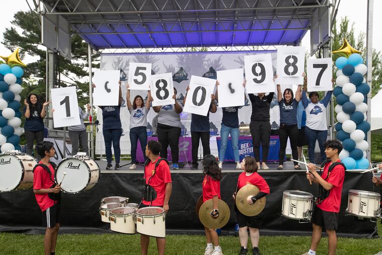The end of Delco Gives Day is celebrated at Rose Tree Park in Media with the announcement of the grand total raised — $1,580, 987. The Penncrest High School drum line is in front.