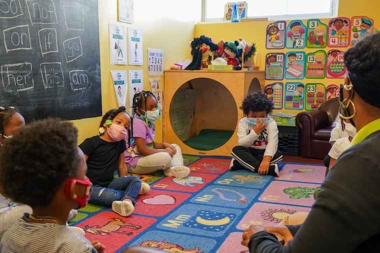 Tanisha Baylor (right) during “circle time” with the 4-year-old students under her care at the Willow School in Norristown on Nov. 11, 2021.