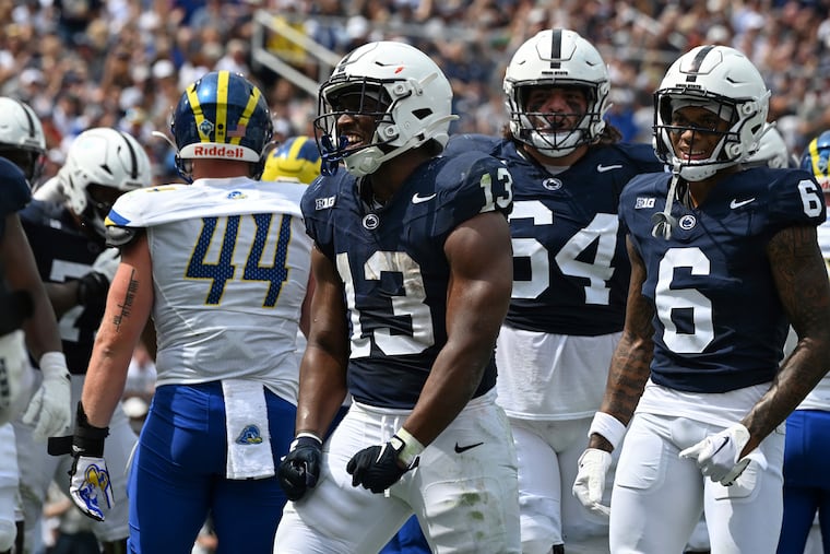 Penn State running back Kaytron Allen (13) who led the Nittany Lions with 104 rushing yards, celebrates after scoring a touchdown against Delaware on Saturday.