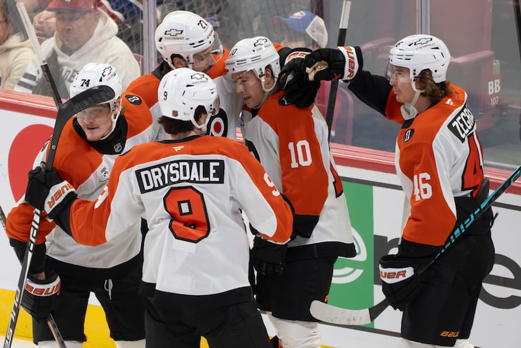 Flyers' Bobby Brink (10) celebrates his goal with his teammates on Tuesday night in Montreal. He scored twice.