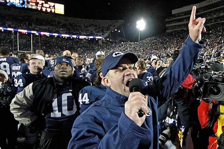 Penn State head coach Bill O'Brien, center, celebrates with his team after a 24-21 overtime win against Wisconsin in an NCAA college football game in State College, Pa., Saturday, Nov. 24, 2012. (Gene J. Puskar/AP)