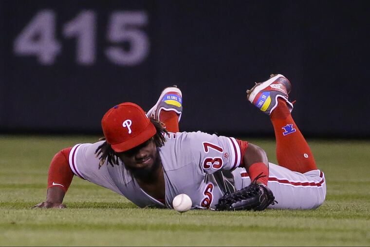 Phillies outfielder Odubel Herrera watches the ball drop in front of him during Tuesday's loss to the Rockies.