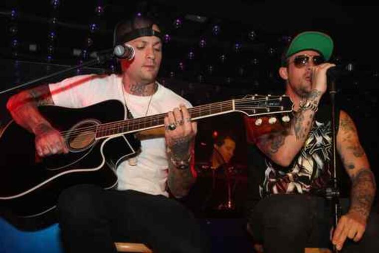 Benji (left) and Joel Madden of Good Charlotte played a surprise acoustic set Friday night at the private grand opening of the nightclub Dusk at Caesars Atlantic City Casino & Hotel. The club's official opening is scheduled for the Fourth of July.