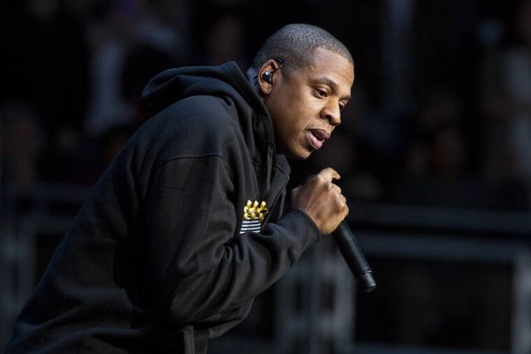 FILE - In this Nov. 5, 2012 file photo, Jay-Z performs at the grassroots rally in support of President Barack Obama at the Nationwide Arena, in Columbus, Ohio. Jay-Z was among the top nominees for the 56th annual Grammy Awards announced Friday, Dec. 6, 2013. (Photo by Barry Brecheisen/Invision/AP, File)