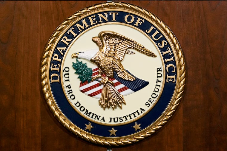 The Department of Justice seal.