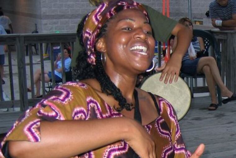A GriotWorks entertainer named Joslyn plays drums during a storytelling session. On Saturday, the organization will present storytelling sessions in four Philadelphia neighborhoods.
