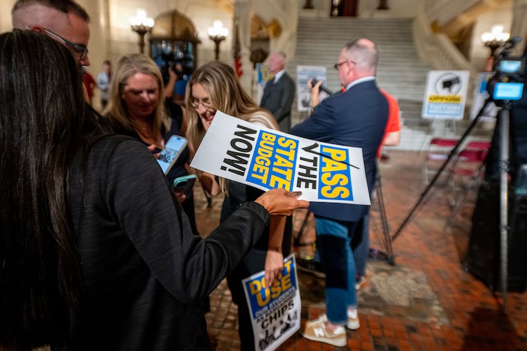 Educators gather following a Pennsylvania State Education Association news conference in the rotunda of the State Capitol in August where officials called on lawmakers to pass a state budget that invests in public schools and reject efforts to tie passage to tuition vouchers.
