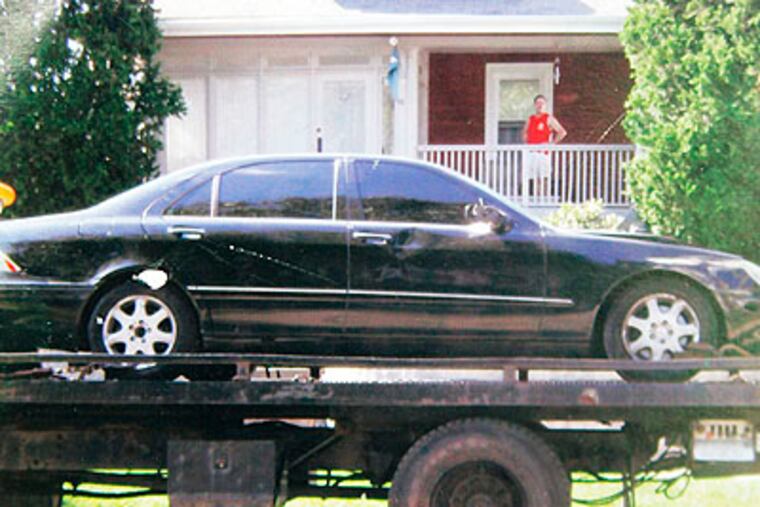 A 2000 Mercedes Benz that police believe was involved in the death of Faith Sinclair in a hit and run accident Sunday night, is towed away from 312 S. Fairview Ave in Upper Darby.